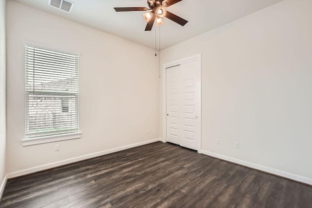 461 Constitution Way, Kyle, TX 78640 - empty room featuring ceiling fan, dark wood-style flooring, and baseboards