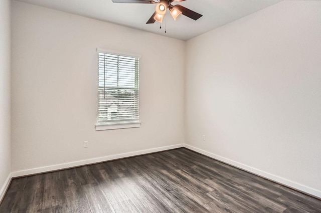 461 Constitution Way, Kyle, TX 78640 - spare room featuring ceiling fan, dark wood-style flooring, and baseboards