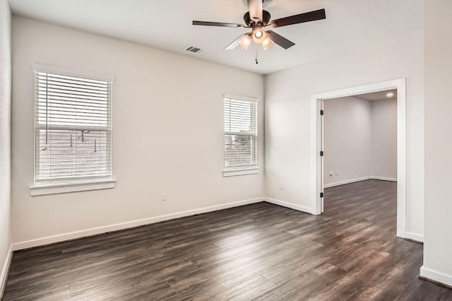 461 Constitution Way, Kyle, TX 78640 - unfurnished room featuring dark wood finished floors, a ceiling fan, and baseboards