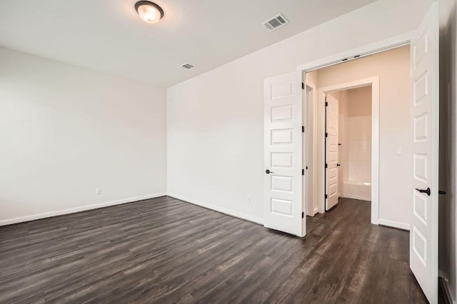 461 Constitution Way, Kyle, TX 78640 - spare room featuring dark wood-style floors and baseboards