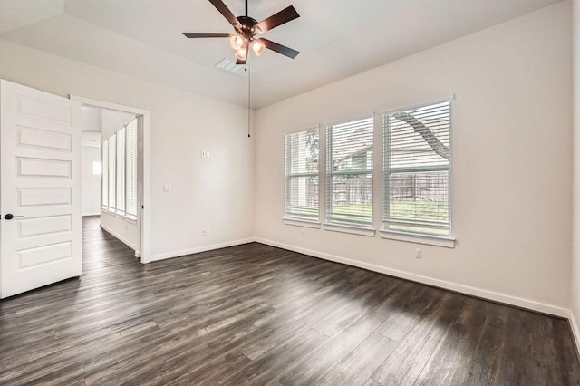 461 Constitution Way, Kyle, TX 78640 - spare room featuring healthy amount of natural light, dark wood-style flooring, baseboards, and a ceiling fan