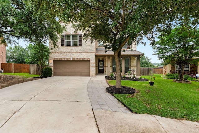 4404 Cierne Cv, Round Rock, TX 78681 - view of front of house with stone siding, driveway, and a garage