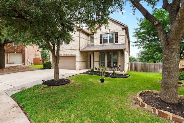 4404 Cierne Cv, Round Rock, TX 78681 - traditional-style home featuring stone siding, driveway, covered porch, and an attached garage