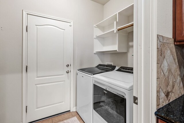 4404 Cierne Cv, Round Rock, TX 78681 - washroom with independent washer and dryer and light tile patterned floors