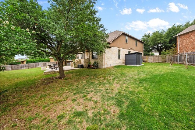 4404 Cierne Cv, Round Rock, TX 78681 - view of yard with a patio and a garage