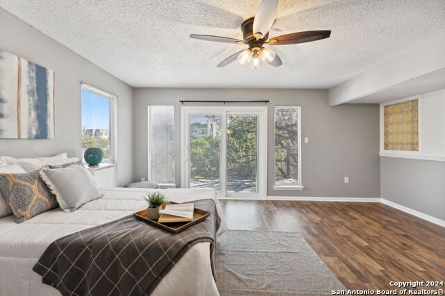 2918 Ranch Road 620th Rd N Unit C122, Austin, TX 78734 - bedroom with a textured ceiling, wood finished floors, baseboards, and a ceiling fan