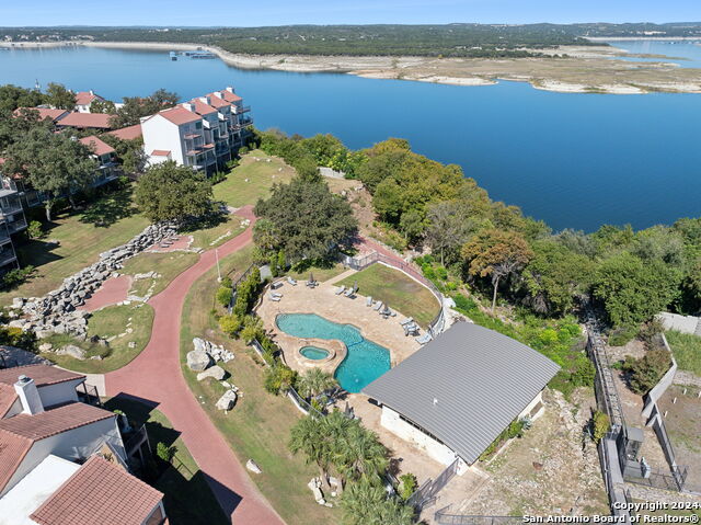 2918 Ranch Road 620th Rd N Unit C122, Austin, TX 78734 - aerial view of property and surrounding area with a pool and a nearby body of water