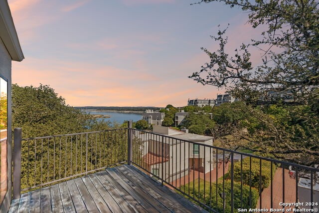 2918 Ranch Road 620th Rd N Unit C122, Austin, TX 78734 - deck at dusk featuring a water view