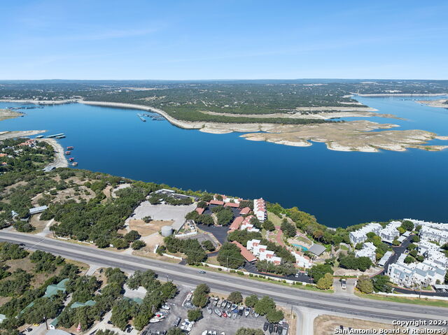 2918 Ranch Road 620th Rd N Unit C122, Austin, TX 78734 - aerial view of property and surrounding area featuring a large body of water