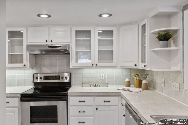 2918 Ranch Road 620th Rd N Unit C122, Austin, TX 78734 - kitchen with stainless steel appliances, under cabinet range hood, tile counters, and open shelves