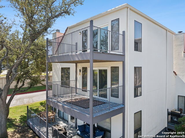 2918 Ranch Road 620th Rd N Unit C122, Austin, TX 78734 - rear view of property with a balcony and stucco siding