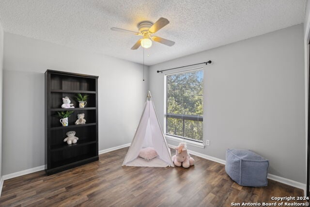 2918 Ranch Road 620th Rd N Unit C122, Austin, TX 78734 - game room featuring a textured ceiling, wood finished floors, a ceiling fan, and baseboards