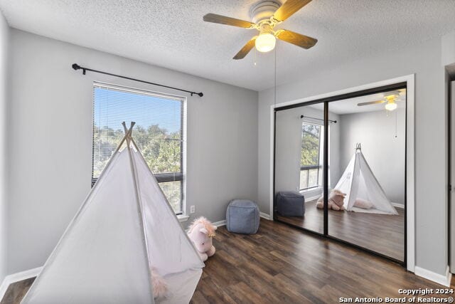2918 Ranch Road 620th Rd N Unit C122, Austin, TX 78734 - game room with a ceiling fan, wood finished floors, a textured ceiling, and baseboards