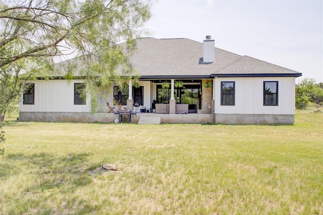 1215 Ridge Harbor Dr, Spicewood, TX 78669 - rear view of house with a chimney, a lawn, board and batten siding, and a shingled roof