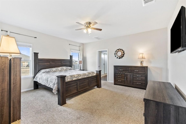 208 Shiner Ln, Georgetown, TX 78626 - bedroom featuring light carpet, multiple windows, baseboards, and a ceiling fan