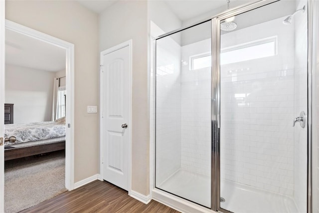 208 Shiner Ln, Georgetown, TX 78626 - ensuite bathroom featuring a shower stall, wood finished floors, and baseboards