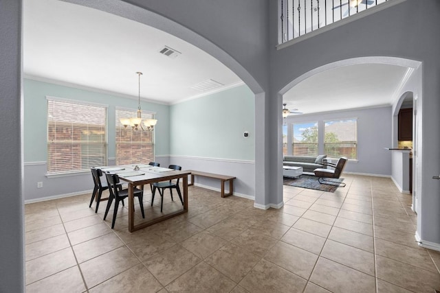 2817 Dusty Chisolm Trl, Pflugerville, TX 78660 - dining area featuring ornamental molding, light tile patterned flooring, baseboards, a chandelier, and a ceiling fan