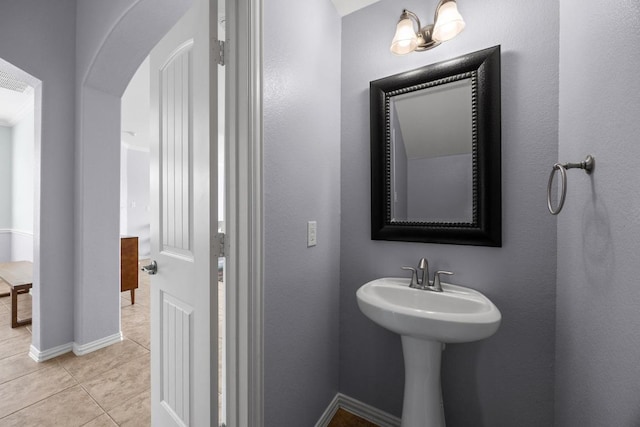 2817 Dusty Chisolm Trl, Pflugerville, TX 78660 - bathroom with tile patterned floors, a sink, and baseboards