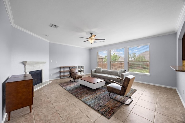 2817 Dusty Chisolm Trl, Pflugerville, TX 78660 - tiled living room with ornamental molding, ceiling fan, baseboards, and a glass covered fireplace