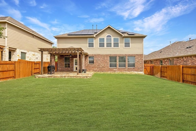 2817 Dusty Chisolm Trl, Pflugerville, TX 78660 - back of property with a pergola, solar panels, a patio, and brick siding