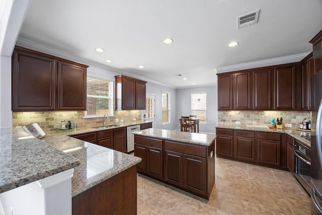 2817 Dusty Chisolm Trl, Pflugerville, TX 78660 - kitchen featuring a sink, appliances with stainless steel finishes, backsplash, recessed lighting, and crown molding