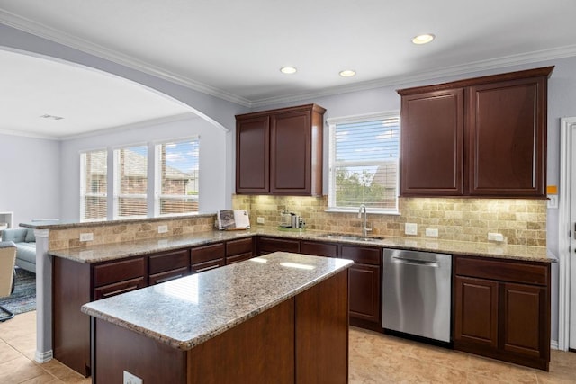 2817 Dusty Chisolm Trl, Pflugerville, TX 78660 - kitchen featuring dishwasher, a sink, a peninsula, light stone counters, and recessed lighting