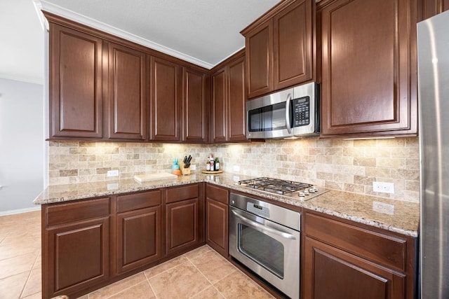 2817 Dusty Chisolm Trl, Pflugerville, TX 78660 - kitchen featuring appliances with stainless steel finishes, tasteful backsplash, light tile patterned floors, and ornamental molding