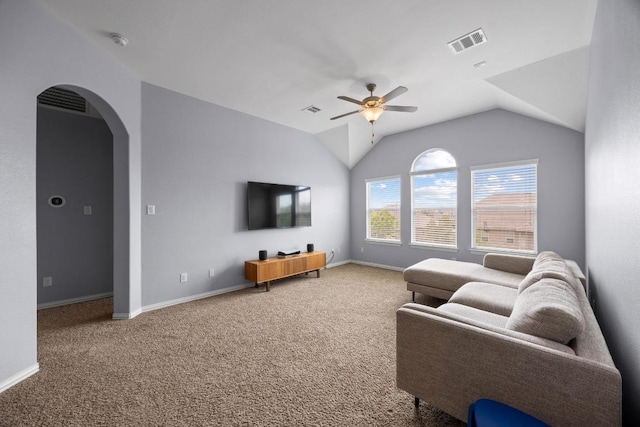 2817 Dusty Chisolm Trl, Pflugerville, TX 78660 - living room with ceiling fan, arched walkways, carpet flooring, lofted ceiling, and baseboards