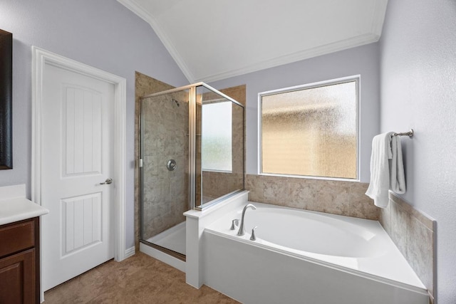 2817 Dusty Chisolm Trl, Pflugerville, TX 78660 - bathroom with lofted ceiling, a garden tub, a stall shower, vanity, and ornamental molding