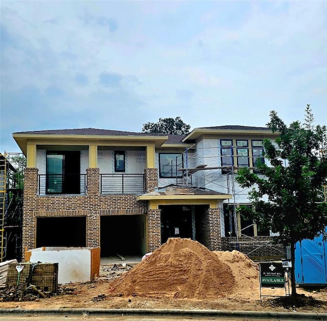 3905 Independent Way, Austin, TX 78731 - view of front of house featuring a balcony, brick siding, an attached garage, and stucco siding