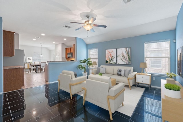 11117 Boundless Valley Dr, Austin, TX 78754 - living room featuring dark tile patterned floors, a ceiling fan, recessed lighting, and baseboards