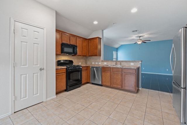 11117 Boundless Valley Dr, Austin, TX 78754 - kitchen featuring black appliances, vaulted ceiling, ceiling fan, brown cabinets, and a sink