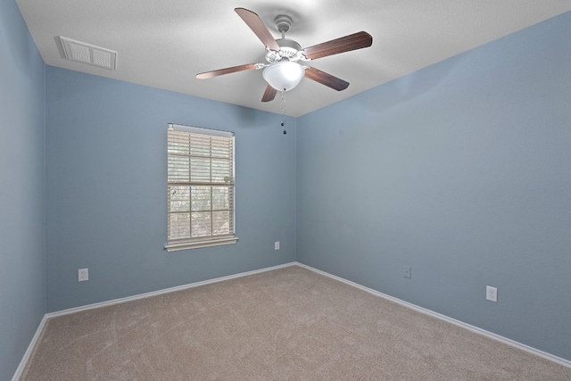 11117 Boundless Valley Dr, Austin, TX 78754 - empty room featuring carpet, a ceiling fan, and baseboards