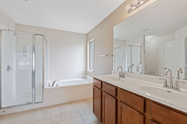 11117 Boundless Valley Dr, Austin, TX 78754 - full bathroom featuring a shower stall, double vanity, a garden tub, and tile patterned floors