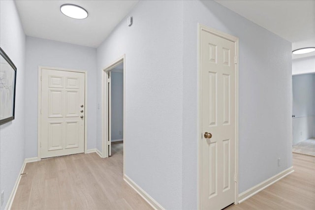 16900 Abyssinian Ln, Round Rock, TX 78681 - hallway with light wood-style floors and baseboards