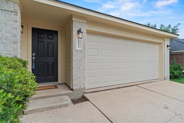 16900 Abyssinian Ln, Round Rock, TX 78681 - view of exterior entry featuring brick siding and a garage