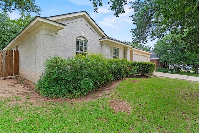 16900 Abyssinian Ln, Round Rock, TX 78681 - view of property exterior with a garage, brick siding, and concrete driveway