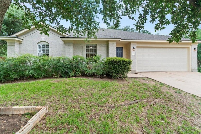 16900 Abyssinian Ln, Round Rock, TX 78681 - ranch-style house with a garage, driveway, and a front yard