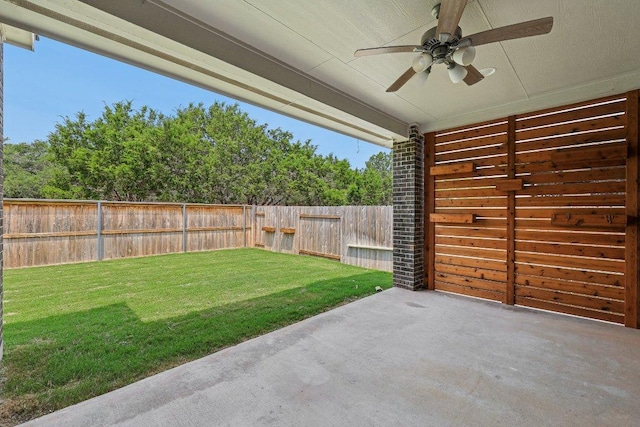 125 Bauer Loop, Liberty Hill, TX 78642 - fenced backyard with ceiling fan and a patio
