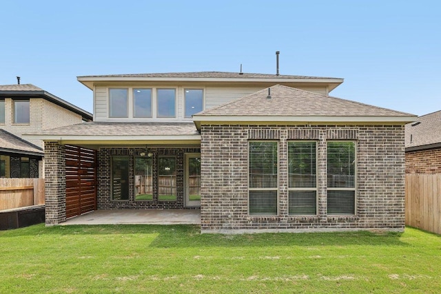 125 Bauer Loop, Liberty Hill, TX 78642 - back of property featuring a patio, brick siding, and a shingled roof