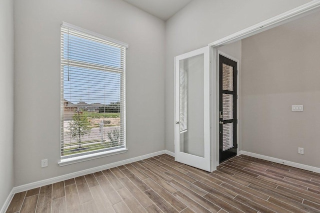 125 Bauer Loop, Liberty Hill, TX 78642 - spare room with dark wood-style floors and baseboards