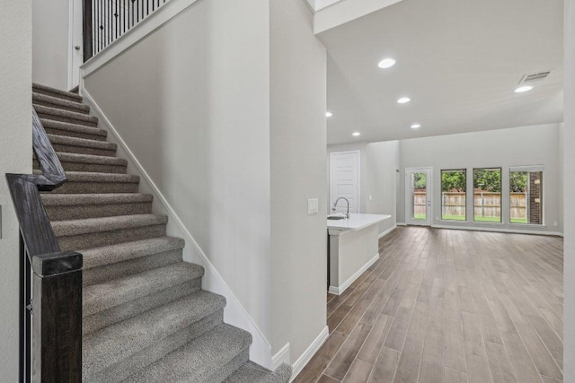 125 Bauer Loop, Liberty Hill, TX 78642 - stairs with wood finished floors and recessed lighting