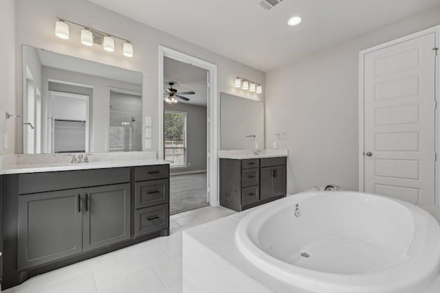 125 Bauer Loop, Liberty Hill, TX 78642 - bathroom featuring a shower stall, two vanities, a tub to relax in, ceiling fan, and tile patterned floors