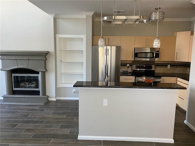 11203 Ranch Road 2222nd Rd Unit 901, Austin, TX 78730 - kitchen with appliances with stainless steel finishes, crown molding, wood finish floors, dark countertops, and hanging light fixtures