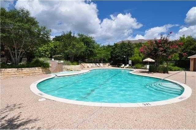 11203 Ranch Road 2222nd Rd Unit 901, Austin, TX 78730 - community pool featuring a patio area and view of wooded area