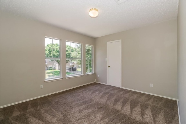 501 Thicket Ln, Kyle, TX 78640 - spare room with dark colored carpet and baseboards
