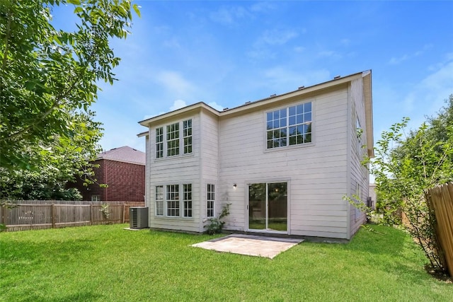 501 Thicket Ln, Kyle, TX 78640 - back of house with central AC unit and a patio
