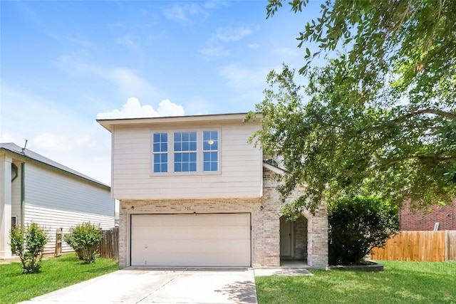 501 Thicket Ln, Kyle, TX 78640 - view of front facade with driveway, a garage, and brick siding