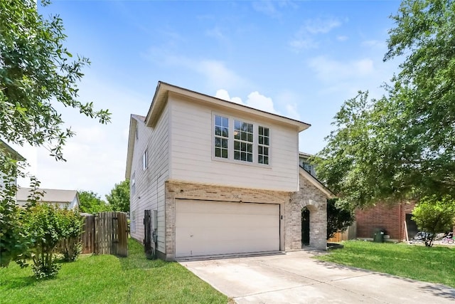 501 Thicket Ln, Kyle, TX 78640 - view of front of house with driveway, a garage, and brick siding