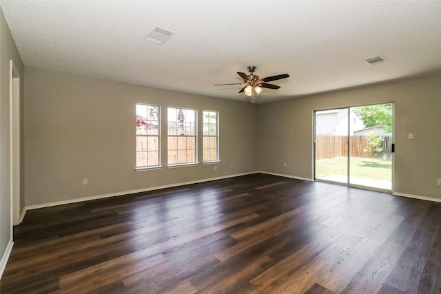 501 Thicket Ln, Kyle, TX 78640 - empty room with plenty of natural light, ceiling fan, and baseboards